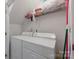 Laundry room equipped with a white washer and dryer, and wire shelving at 12350 Swan Wings Pl, Huntersville, NC 28078