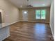 Open floor plan living room with wood flooring, neutral walls, and natural light at 136 Ridge Run Dr, Statesville, NC 28625