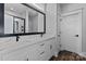Double sink bathroom vanity with marble countertops, black hardware, and custom mirror at 1644 Dresden St, Rock Hill, SC 29732