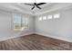 Bright bedroom with hardwood floors, recessed lighting, large windows and ceiling fan at 1644 Dresden St, Rock Hill, SC 29732