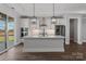 Modern kitchen with white cabinetry, quartz countertops, stainless steel appliances, and an island with pendant lighting at 1644 Dresden St, Rock Hill, SC 29732
