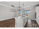Bright kitchen island with a sink, pendant lighting, hardwood floors, and stainless steel appliances nearby at 1644 Dresden St, Rock Hill, SC 29732