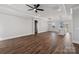 Open-concept living area boasts hardwood floors, recessed lighting, white trim, and a view into the bright kitchen at 1644 Dresden St, Rock Hill, SC 29732