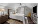 Bedroom featuring a queen-sized bed and bedside tables and hardwood floors at 17112 Courtside Landing Dr, Cornelius, NC 28031