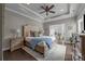 Spacious bedroom features a king-size bed, tray ceiling, neutral color palette and abundant natural light at 17112 Courtside Landing Dr, Cornelius, NC 28031