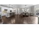Open floor plan features the kitchen island, dining area, and living room with plenty of natural light at 17112 Courtside Landing Dr, Cornelius, NC 28031