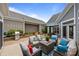 Open patio area with outdoor seating and stainless steel grill at 17112 Courtside Landing Dr, Cornelius, NC 28031