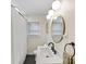Modern bathroom with a sleek vanity, matte black fixtures, and stylish mirror at 1723 Woodland Dr, Charlotte, NC 28205