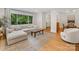 Bright and airy living room with hardwood floors and large windows providing ample natural light at 1723 Woodland Dr, Charlotte, NC 28205