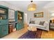 View of a cozy living room with stylish furniture, hardwood floors, and a distinctive wooden coffee table at 1723 Woodland Dr, Charlotte, NC 28205