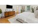 Well-lit bedroom with stylish furnishings, hardwood floors, and a serene atmosphere at 1723 Woodland Dr, Charlotte, NC 28205