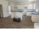 Spacious kitchen with white cabinets, granite countertops, and stainless steel appliances at 2300 Grayson Pkwy, Monroe, NC 28110