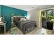 Charming bedroom with a sliding glass door to the outdoor, wood-look floors, and modern decor at 2533 Stockbridge Dr, Charlotte, NC 28210