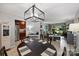 Open-concept dining area flowing into living room and kitchen at 2533 Stockbridge Dr, Charlotte, NC 28210
