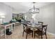Well-lit dining area featuring modern chandelier and open layout at 2533 Stockbridge Dr, Charlotte, NC 28210