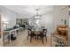 Well-lit dining area featuring modern chandelier and open layout at 2533 Stockbridge Dr, Charlotte, NC 28210