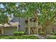 Charming condo exterior with mature trees and well-maintained landscaping at 2533 Stockbridge Dr, Charlotte, NC 28210
