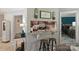 View of the kitchen bar, dark wood cabinets, granite countertops and stool seating at 2533 Stockbridge Dr, Charlotte, NC 28210