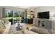 Bright living room with sliding glass doors to the patio, wood-look floors, and stylish furnishings at 2533 Stockbridge Dr, Charlotte, NC 28210