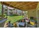 Comfortable outdoor patio seating with wooded ceiling and manicured lawn at 2533 Stockbridge Dr, Charlotte, NC 28210