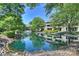 Beautiful pond with a fountain, surrounded by lush greenery and well-maintained landscaping at 2533 Stockbridge Dr, Charlotte, NC 28210