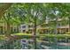 Scenic view of a pond reflecting homes and trees, nestled in lush greenery at 2533 Stockbridge Dr, Charlotte, NC 28210