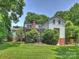 Expansive backyard showcasing the home's exterior, landscaping, and outdoor space at 2919 Wickersham Rd, Charlotte, NC 28211