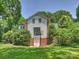 Spacious backyard showing the back of the house and garage access at 2919 Wickersham Rd, Charlotte, NC 28211