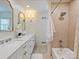 Bright bathroom featuring a double sink vanity, modern fixtures, and a shower with tiled walls at 2919 Wickersham Rd, Charlotte, NC 28211
