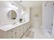 Bright bathroom with double vanity, white cabinets, and modern fixtures offers a serene space at 2919 Wickersham Rd, Charlotte, NC 28211