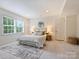 Comfortable bedroom with a queen bed, soft rug, and a large window, creating a relaxing space at 2919 Wickersham Rd, Charlotte, NC 28211