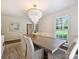 Elegant dining room with a chandelier, large table and bright, natural light at 2919 Wickersham Rd, Charlotte, NC 28211
