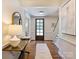 Welcoming foyer with hardwood floors, a staircase, and ample natural light at 2919 Wickersham Rd, Charlotte, NC 28211