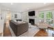 Inviting living room with hardwood floors, fireplace, and access to the outdoor patio at 2919 Wickersham Rd, Charlotte, NC 28211