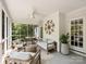 Relaxing screened porch with ceiling fan and elegant decor enhances outdoor living at 2919 Wickersham Rd, Charlotte, NC 28211