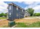 Beautiful new construction home with navy siding, a modern design, and a well-manicured lawn at 304 Cabarrus W Ave, Concord, NC 28025