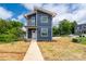 Modern two-story home with blue siding, white trim, and a well-maintained front yard at 304 Cabarrus W Ave, Concord, NC 28025