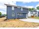 Modern two-story house with blue siding, white trim, and a concrete driveway at 304 Cabarrus W Ave, Concord, NC 28025