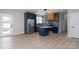 Well-lit kitchen with modern appliances, blue cabinetry, and an open layout at 304 Cabarrus W Ave, Concord, NC 28025