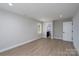 Spacious living room featuring wood flooring, neutral walls, and ample natural light at 304 Cabarrus W Ave, Concord, NC 28025