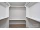 Walk-in closet with modern shelving and ample storage space at 304 Cabarrus W Ave, Concord, NC 28025