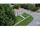 A captivating aerial perspective of a two-story home with beautiful lawn and mature trees in the surroundings at 315 E Washington Ave, Bessemer City, NC 28016