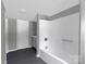 A bathroom with gray walls features a shower and an adjacent vanity at 315 E Washington Ave, Bessemer City, NC 28016