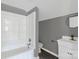 Bathroom featuring a tub, toilet, and vanity with a mirror at 315 E Washington Ave, Bessemer City, NC 28016