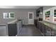 A well-lit kitchen features granite countertops, modern gray cabinetry, and an ample sink at 315 E Washington Ave, Bessemer City, NC 28016
