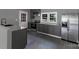 This home features a well-lit kitchen with stainless steel appliances, ample counter space, and gray cabinetry at 315 E Washington Ave, Bessemer City, NC 28016