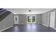 A living room features ample natural light, modern floors, and a staircase at 315 E Washington Ave, Bessemer City, NC 28016