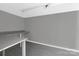 An empty room with gray walls features built-in shelves and dark modern floors at 315 E Washington Ave, Bessemer City, NC 28016