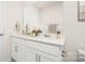 Well-lit bathroom with double vanity, white cabinets, and modern fixtures at 3734 Coleman Dr, Charlotte, NC 28215