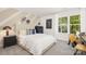 Well-decorated bedroom featuring a window, striped bedding, and a youthful aesthetic at 3734 Coleman Dr, Charlotte, NC 28215